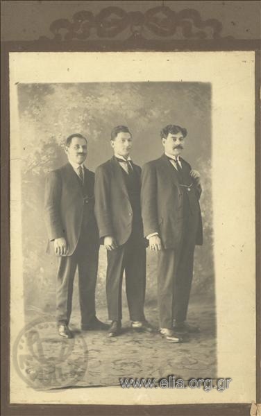 Portrait of three men.