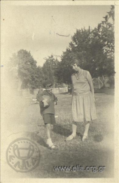 Woman with a boy in a park
