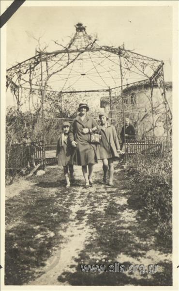 Woman with two girls in a park