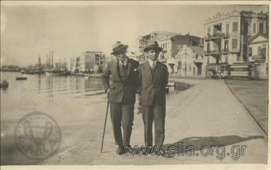 Portrait of two men at a port.
