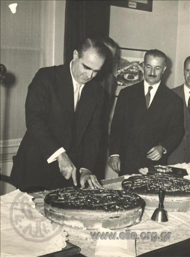 Prime Minister Konstantinos Karamanlis at the pie-cutting ceremony of the Olympic Committee