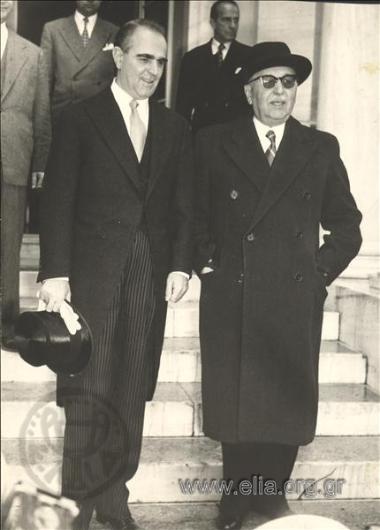 The new Prime-Minister Konstantinos Karamanlis with the president of the Hellenic Red Cross Georgakopoulos exit the palace.