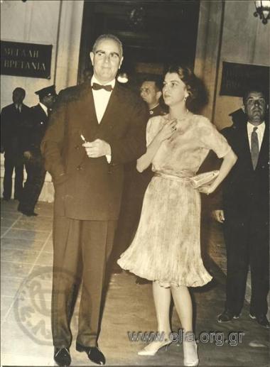 Prime Minister Konstantinos Karamanlis with his wife Amalia at the entrance to the Grande Bretagne Hotel.