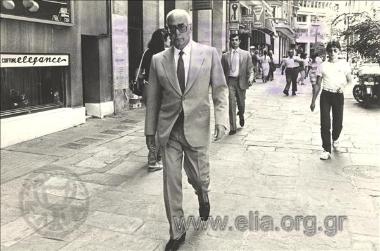 Prime Minister Georgios Rallis walks alone along the pedestrian precinct in Valaoritou Street