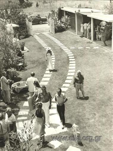 Spyros  Vasileiou at a reception in a garden.