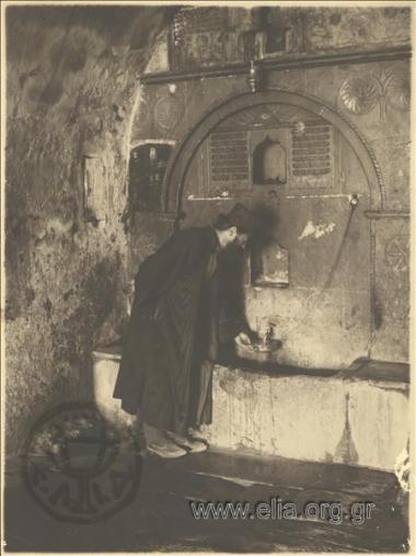 Monk at a spring.