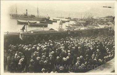Crowd at harbour fot the welcoming of Panagis Tsaldaris during his pre-election campaign.