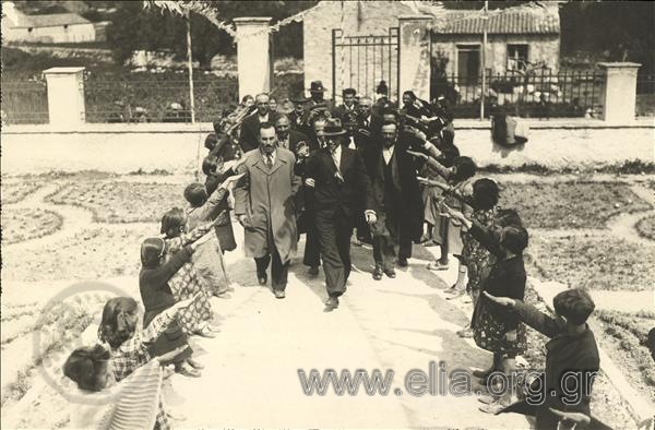 A Minister  of the Metaxa government arriving at a school for the  swearing-in of members of EON (National Youth Organization)