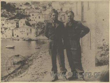 Portrait of two Greek  soldiers at  a small port of the island.