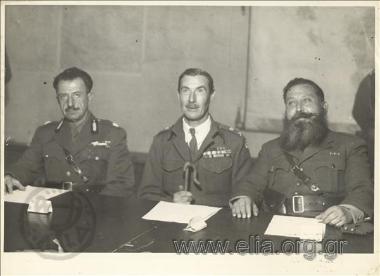 12 February. - ELAS military commander General Stefanos Sarafis, General Ronald Scobie, commander of the British forces in Athens and EDES military commander Napoleon Zervas sign the Varkiza Pact