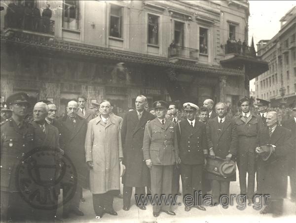 Servicemen and politicians(?) in an official ceremony.