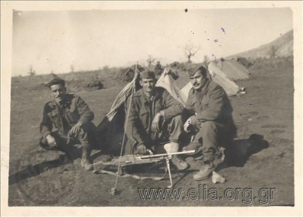Soldiers of the National Army posing in front of the small tents on Parnonas mountain.
