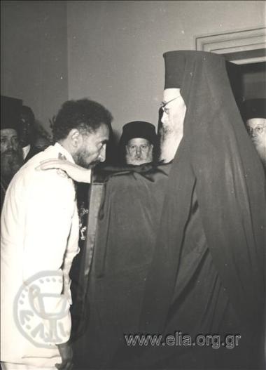 Archbishop Chrisostomos II presenting Emperor of Ethiopia Haile Selasie with a golden pectoral cross in a state ceremony at the Odeon of  Herodus Atticus