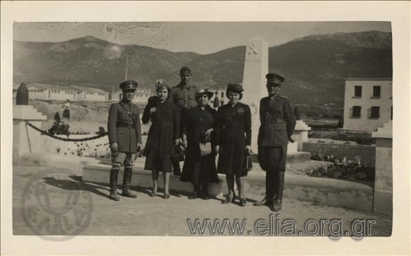 Portrait of military women in front of a memorial.