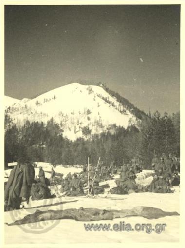 Soldiers skiers on mountain.