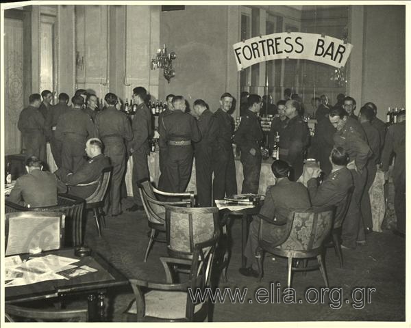 November, British officers at the bar of the Grande Bretagne hotel.