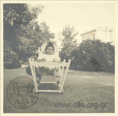 Nikolas Kalas (1907-1988) as a baby on a chair in his garden in Kifisia.