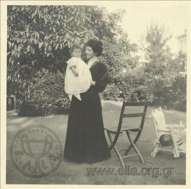 Nikolas Kalas (1907-1988) as a baby in his mother's arms in his garden in Kifisia