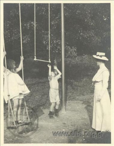 Nikolas Kalas (1907-1988) as a child with friends at the swings in a park at Champ Soleil.