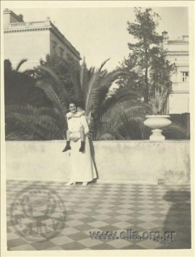 Nikolas Kalas (1907-1988) as a child with his nanny on a veranda.