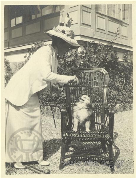 Woman with dog in a garden, Champ Palace.
