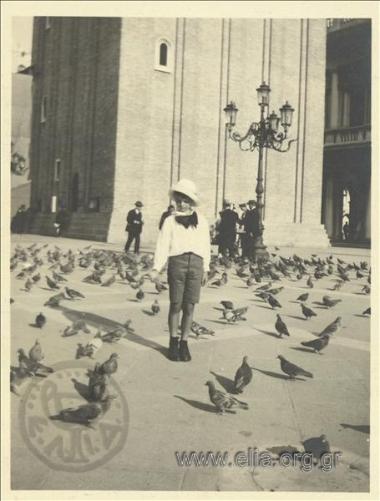 Nikolas Kalas (1907-1988) as a child feeding pigeons at Ag. Markou Square.