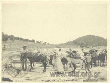 Men and women with donkeys