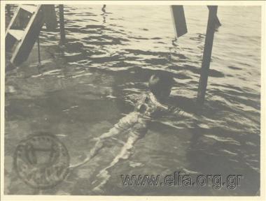 Child swims in the sea.