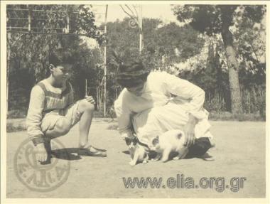 Nikolas Kalas (1907-1988) as a child with his nanny and cats in the garden, Kifisia.