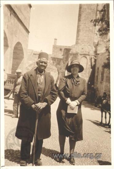 Nikolas Kalas' mother (1907-1988) with a muslim on the Street of the Knights.