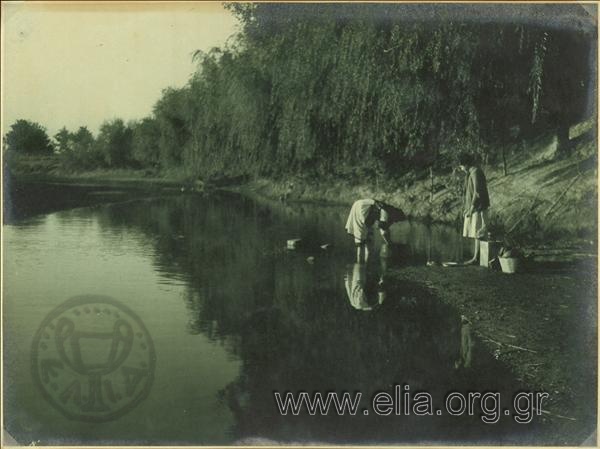Women washing wheat at Pineios River