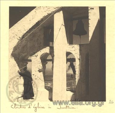 Priest ringing the bells