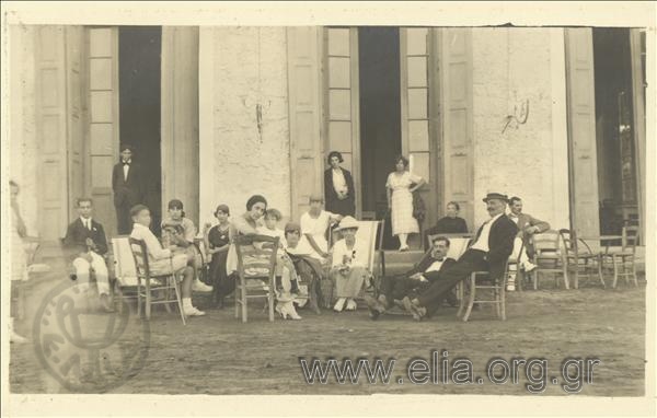 Excursionists  sitting outside a hotel