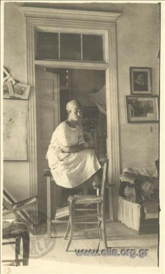 Young woman poses inside the Lounghi mansion.