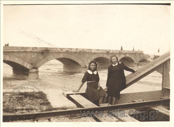 Two women at a bridge