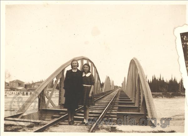 Two women at a bridge