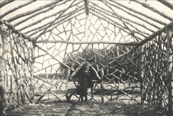 Woman at a wooden structure