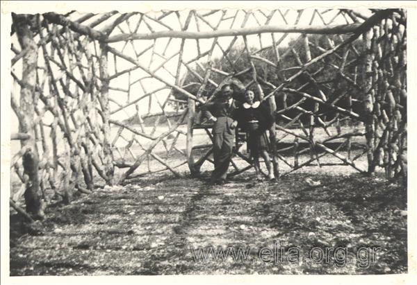 Man and woman at a wooden structure
