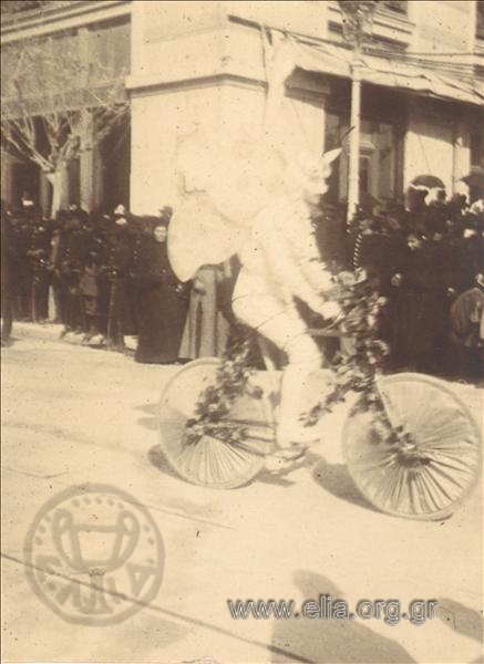A mummer on bicycle.