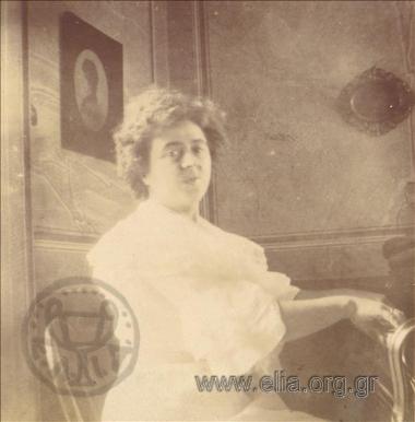 Portrait of a woman inside a house.