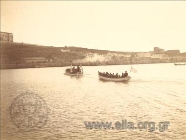 Navy steam and rowing boats heading for the quay of the Navy School
