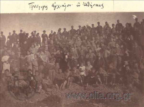 Refugees from Anchialos gathered at a sandlot