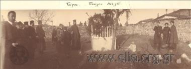 Priests and citizens next to the grave of Paul  Melas.