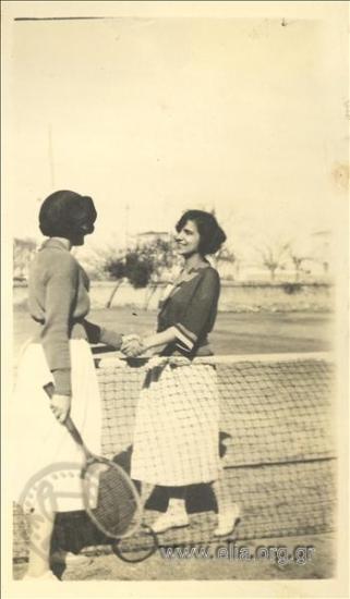Two girls on a tennis court