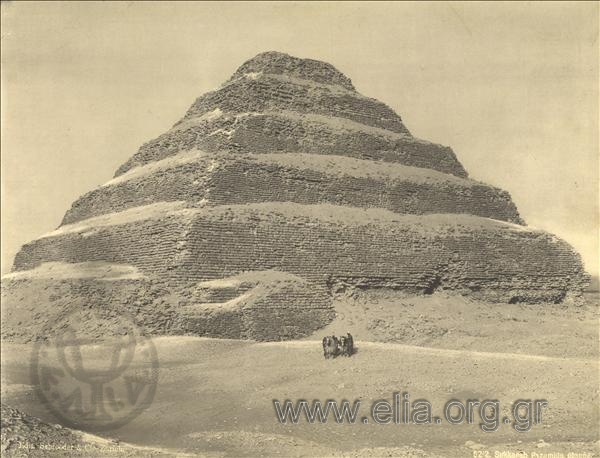 Pyramid, two bedouins with horses.