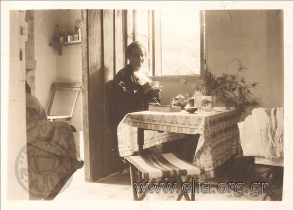 Thaleia Flora Karavia (Siatista 1871-Athens 1960) in a house