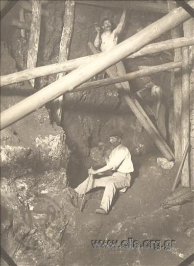 Mines. Two miners worKing in the stoa