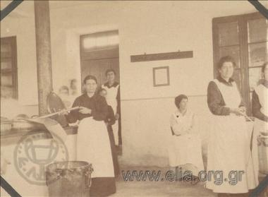 In the kitchen, preparing meals for the poor.