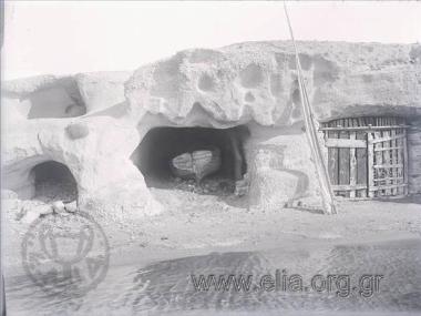 Cave in the face of a rock with boat and sail