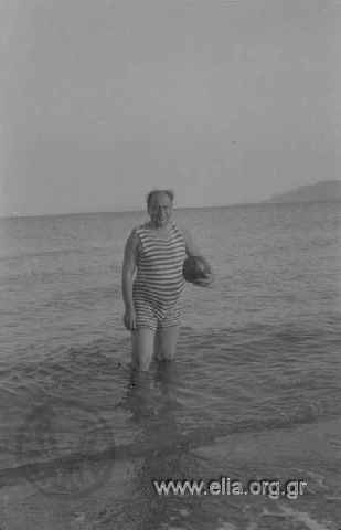 Bather in striped bathing suit.